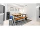 The dining area features a wood table with bench and chairs, plus a water cooler at 9481 Highland Oak Dr # 1504, Tampa, FL 33647