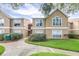 Charming exterior view of a condo complex with well-maintained grounds at 9481 Highland Oak Dr # 1504, Tampa, FL 33647