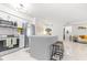 Modern condo kitchen with stainless steel appliances and a central island at 9481 Highland Oak Dr # 1504, Tampa, FL 33647