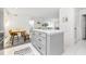 Bright condo kitchen with island, updated appliances, and dining area at 9481 Highland Oak Dr # 1504, Tampa, FL 33647