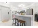 Updated condo kitchen with a stylish island and stainless steel appliances at 9481 Highland Oak Dr # 1504, Tampa, FL 33647