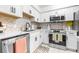 Modern condo kitchen with updated countertops, backsplash, and stainless steel appliances at 9481 Highland Oak Dr # 1504, Tampa, FL 33647