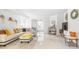 Bright living room with white sofa, stylish pillows, and an open layout at 9481 Highland Oak Dr # 1504, Tampa, FL 33647
