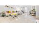 An open living room with large white couch and an adjoining small bedroom with daybed at 9481 Highland Oak Dr # 1504, Tampa, FL 33647