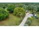 Aerial view of the home and lot featuring a large green tree at 9615 Raiden Ln, Riverview, FL 33569