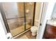 Bathroom featuring a shower stall with glass door, and a toilet at 9615 Raiden Ln, Riverview, FL 33569