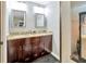 Bathroom featuring granite countertop vanity with a double sink and dark cabinets at 9615 Raiden Ln, Riverview, FL 33569