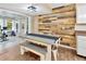Charming dining area featuring rustic wood accent wall and an open floor plan, perfect for Gathering meals and gatherings at 9615 Raiden Ln, Riverview, FL 33569