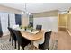 Formal dining room with stylish wainscotting and a decorative chandelier fixture at 9615 Raiden Ln, Riverview, FL 33569