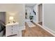Hallway featuring hardwood flooring, a large mirror, and decor at 9615 Raiden Ln, Riverview, FL 33569