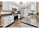 Modern kitchen with stainless steel appliances, sleek countertops, and ample storage, ideal for culinary enthusiasts at 9615 Raiden Ln, Riverview, FL 33569
