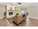 Inviting living room with fireplace, hardwood floors, and a cozy atmosphere, perfect for relaxing and entertaining guests at 9615 Raiden Ln, Riverview, FL 33569