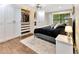 Bedroom with built-in closet and drawers, hardwood floors, and ceiling fan at 9615 Raiden Ln, Riverview, FL 33569
