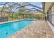 Enclosed swimming pool with spa and outdoor seating to enjoy the view at 9615 Raiden Ln, Riverview, FL 33569