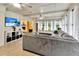 Bright sunroom with multiple windows, providing natural light and views of the outdoors and seamless access to other living areas at 9615 Raiden Ln, Riverview, FL 33569