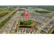 Serene aerial view of a neighborhood with lush greenery, multiple water features, and a nearby highway at 16121 Soft Fern Trace, Odessa, FL 33556