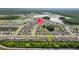 Expansive aerial view showcasing a well-maintained community with multiple ponds and lush green spaces at 16121 Soft Fern Trace, Odessa, FL 33556