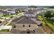 Aerial shot of a home's backyard featuring the roof and a view of the neighborhood at 16121 Soft Fern Trace, Odessa, FL 33556