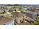 Aerial view of the backyard with patio seating and a grill at 16121 Soft Fern Trace, Odessa, FL 33556