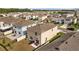 Aerial view of the backyard with patio seating, a grill, and a fenced-in yard at 16121 Soft Fern Trace, Odessa, FL 33556
