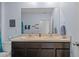 Bright bathroom with double sinks and ample counter space, designed for convenience and functionality at 16121 Soft Fern Trace, Odessa, FL 33556