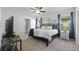 Serene bedroom with modern decor, featuring a plush bed and soft lighting for a relaxing atmosphere at 16121 Soft Fern Trace, Odessa, FL 33556
