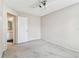 Empty bedroom with neutral paint, ceiling fan, and access to the ensuite bathroom at 10208 Evening Trail Dr, Riverview, FL 33569