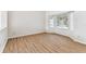 Empty bedroom with beautiful laminate flooring and natural light from window at 10208 Evening Trail Dr, Riverview, FL 33569
