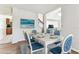 Dining room featuring wood floors, decor painting, dining table with six chairs, and kitchen view at 10208 Evening Trail Dr, Riverview, FL 33569