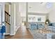 Bright, open living area with wood flooring and stylish, comfortable furniture at 10208 Evening Trail Dr, Riverview, FL 33569