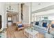 Bright, open living area with wood flooring and stylish, comfortable furniture at 10208 Evening Trail Dr, Riverview, FL 33569