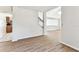 Bright living room featuring wood floors, white walls, and stair access to the second level at 10208 Evening Trail Dr, Riverview, FL 33569