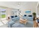 Cozy staged living room featuring comfortable seating, a rug, and decor at 10208 Evening Trail Dr, Riverview, FL 33569