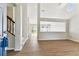 Bright, open living area with wood flooring and a view to the backyard at 10208 Evening Trail Dr, Riverview, FL 33569