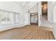 Bright, open living area featuring wood flooring and large window at 10208 Evening Trail Dr, Riverview, FL 33569