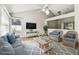 Bright and airy living room, featuring stylish decor and laminate wood-look floors at 10208 Evening Trail Dr, Riverview, FL 33569