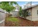 Small backyard featuring a fence and partial covering of pine straw at 10623 103Rd St, Largo, FL 33773