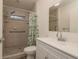 Updated bathroom featuring tiled shower and modern vanity at 10623 103Rd St, Largo, FL 33773