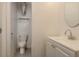 Bathroom featuring a toilet, vanity with sink, and a neutral color scheme at 10623 103Rd St, Largo, FL 33773