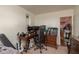 Bedroom features a computer desk, gaming setup, and casual decor at 10623 103Rd St, Largo, FL 33773