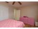 Bedroom with wood floors, a ceiling fan, and a pink dresser for storage at 10623 103Rd St, Largo, FL 33773