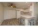 Well-lit kitchen area features white cabinetry, bar seating, and ample storage at 10623 103Rd St, Largo, FL 33773