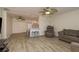 Spacious open-concept living area connecting to the kitchen and featuring updated flooring at 10623 103Rd St, Largo, FL 33773