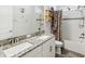 Bathroom featuring double vanity with granite countertop and tiled shower at 10669 Cardera Dr, Riverview, FL 33578