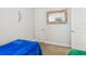 Bedroom featuring blue blanket and mirror at 10669 Cardera Dr, Riverview, FL 33578