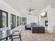 Inviting covered patio with comfortable seating, fireplace, and televisions for resident enjoyment at 10669 Cardera Dr, Riverview, FL 33578