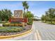 Landscaped entrance to Mariposa with the community name and lush greenery at 10669 Cardera Dr, Riverview, FL 33578