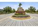 A welcoming entrance to Mariposa featuring lush landscaping and an elegant sign at 10669 Cardera Dr, Riverview, FL 33578