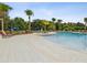 Inviting community pool with ample lounge seating and nearby playground, perfect for Gathering fun at 10669 Cardera Dr, Riverview, FL 33578