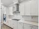 Well-appointed kitchen with sleek countertops, stainless steel range hood, and ample cabinetry at 10669 Cardera Dr, Riverview, FL 33578